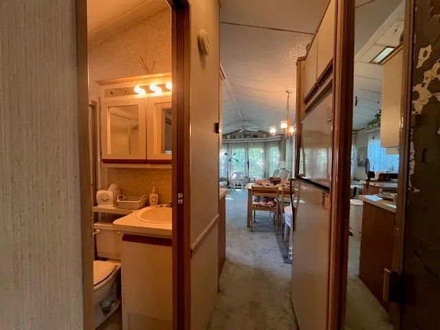 a view of a wooden deck and a forest