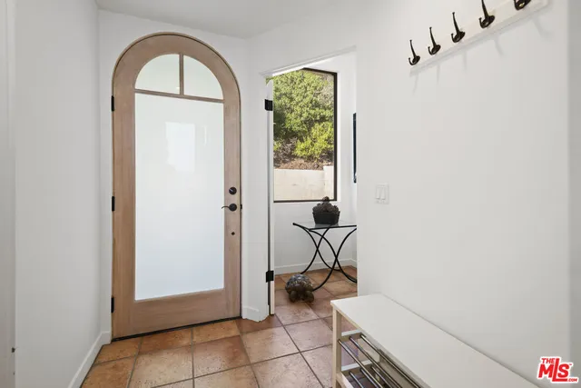 a view of room with a window and couch