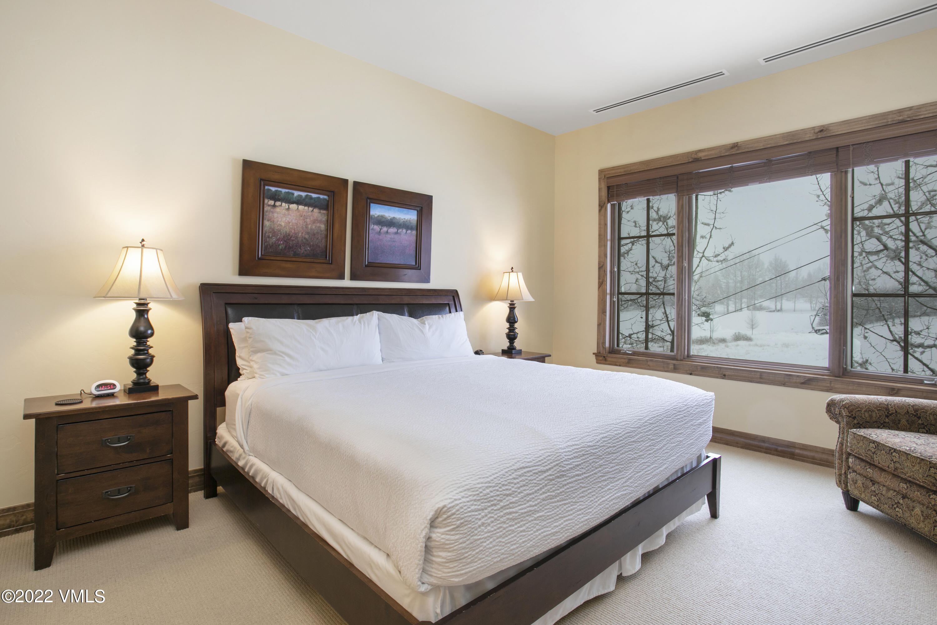 300 Prater Road, Unit B303 Beaver Creek, CO 81620 - Photo 12 of 38 a bedroom with a bed and a couch next to a window