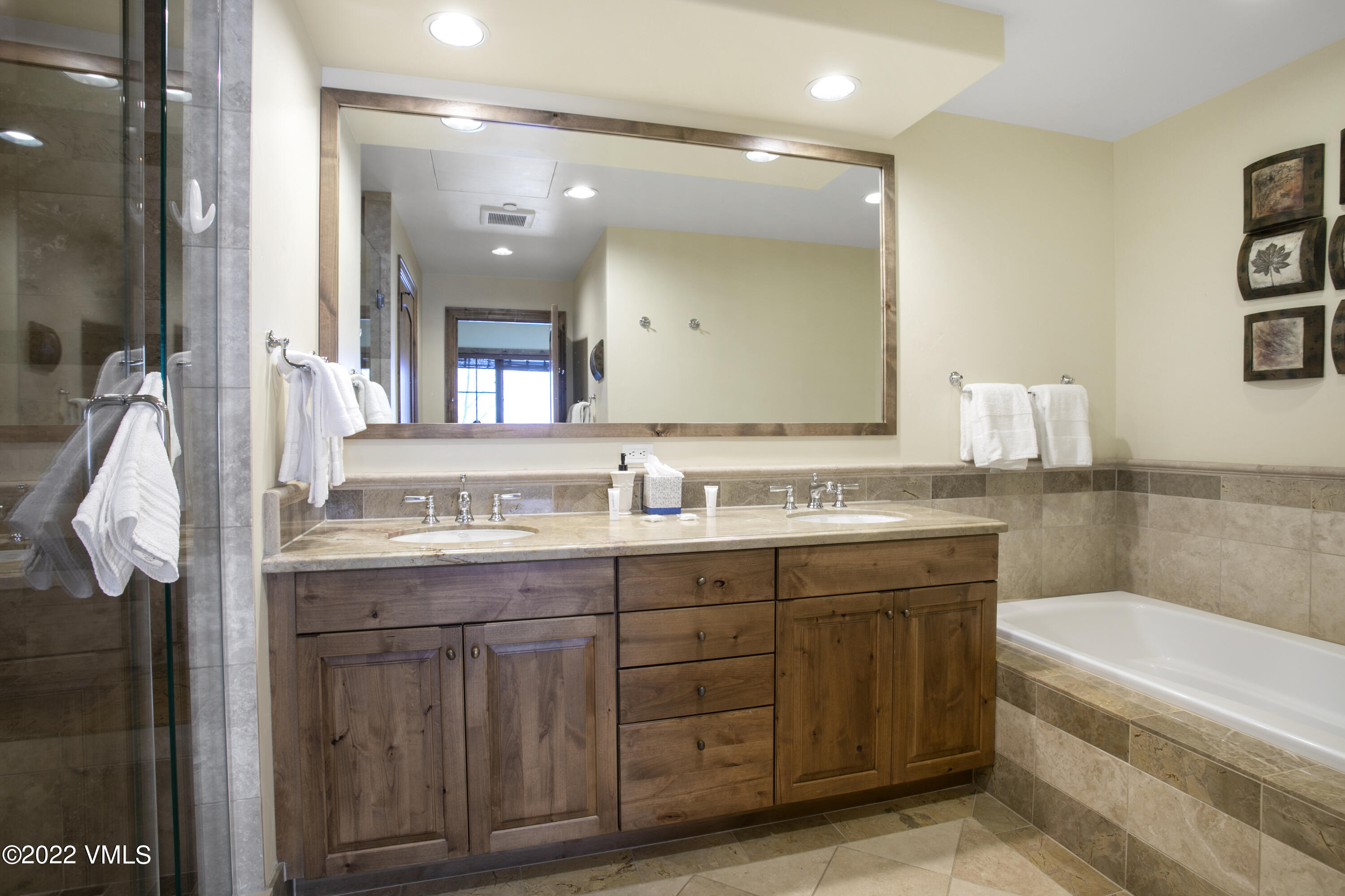 300 Prater Road, Unit B303 Beaver Creek, CO 81620 - Photo 14 of 38 a bathroom with a granite countertop sink mirror and bathtub