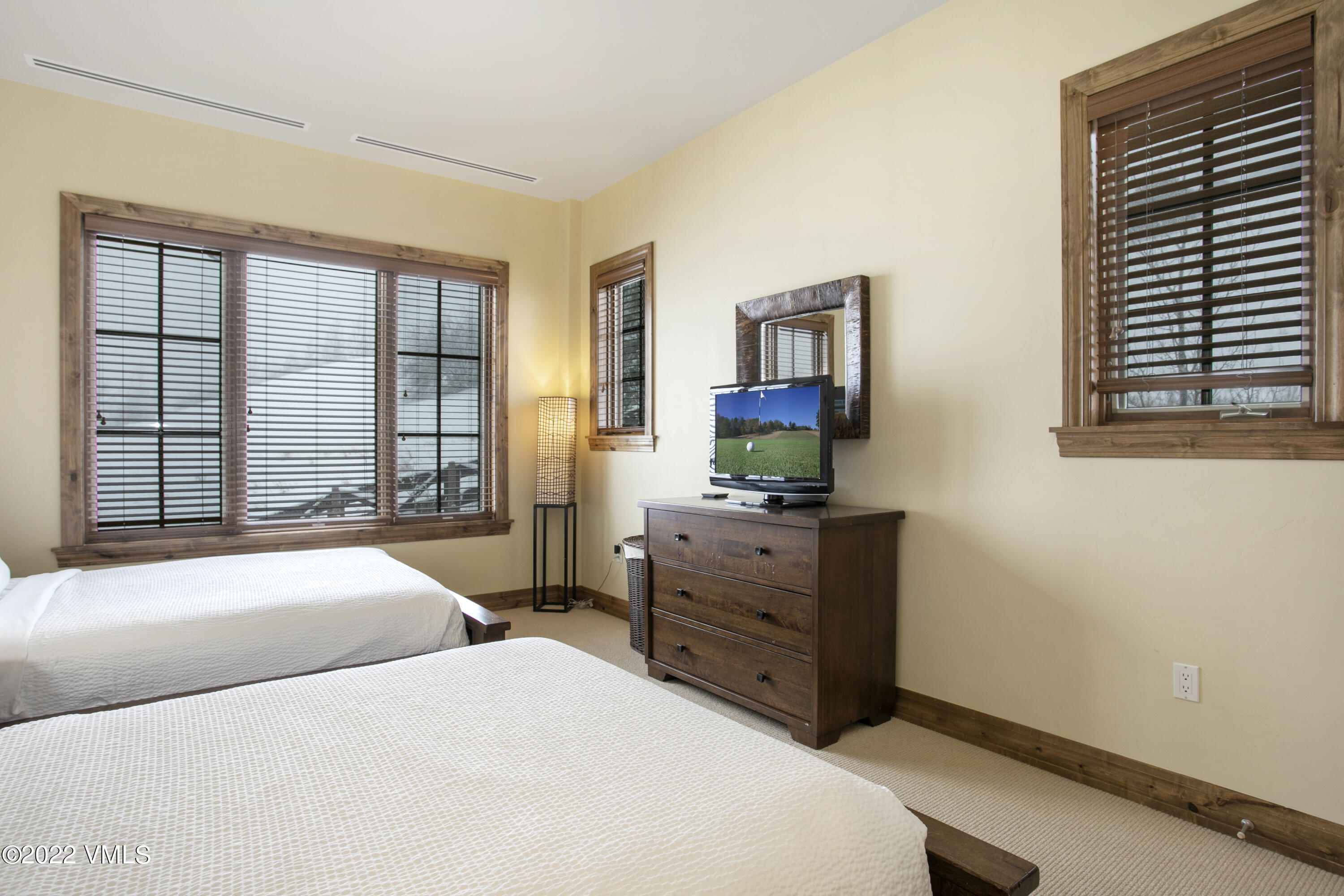 300 Prater Road, Unit B303 Beaver Creek, CO 81620 - Photo 19 of 38 a bedroom with a bed and a window