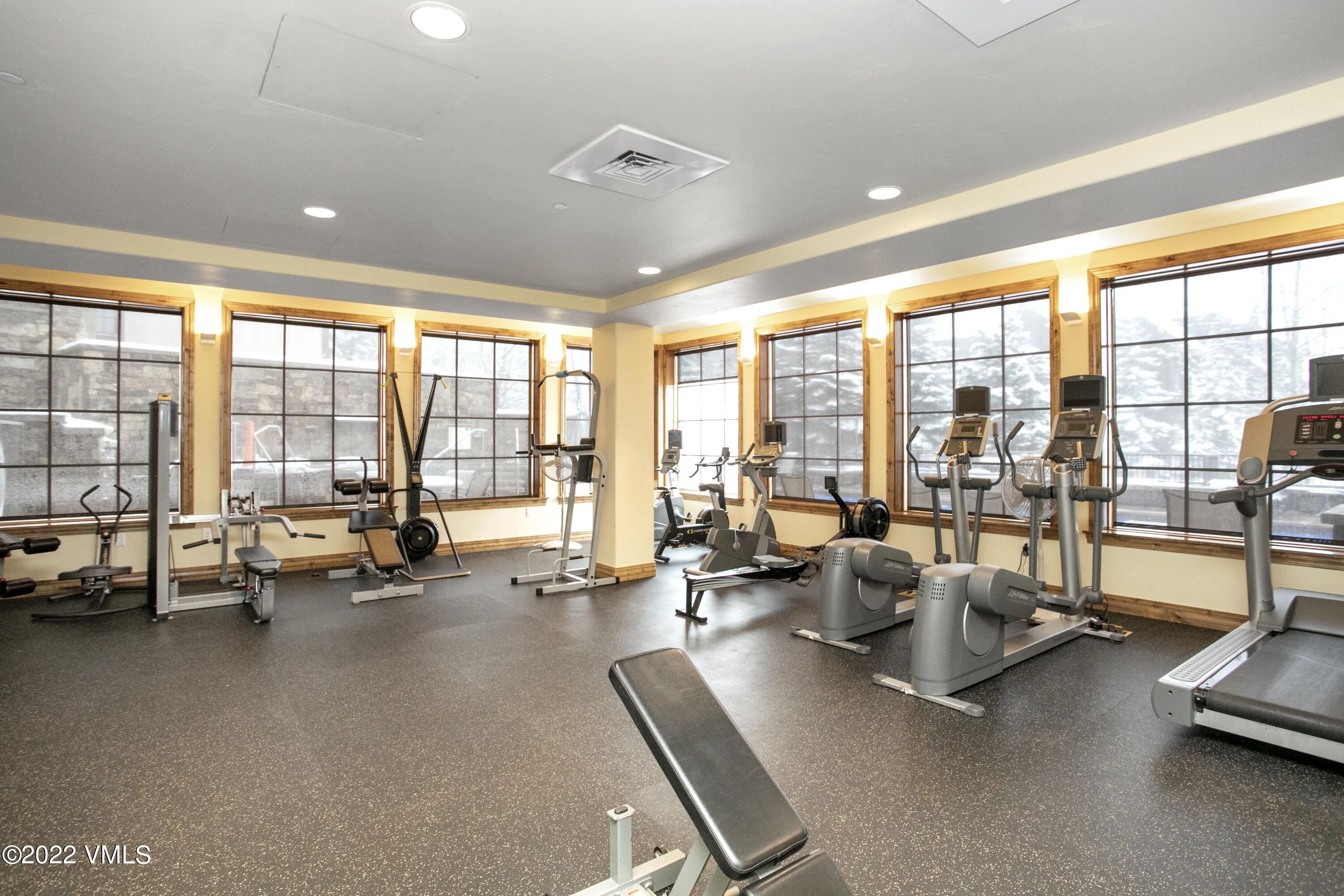 300 Prater Road, Unit B303 Beaver Creek, CO 81620 - Photo 24 of 38 a room with gym equipment and large windows