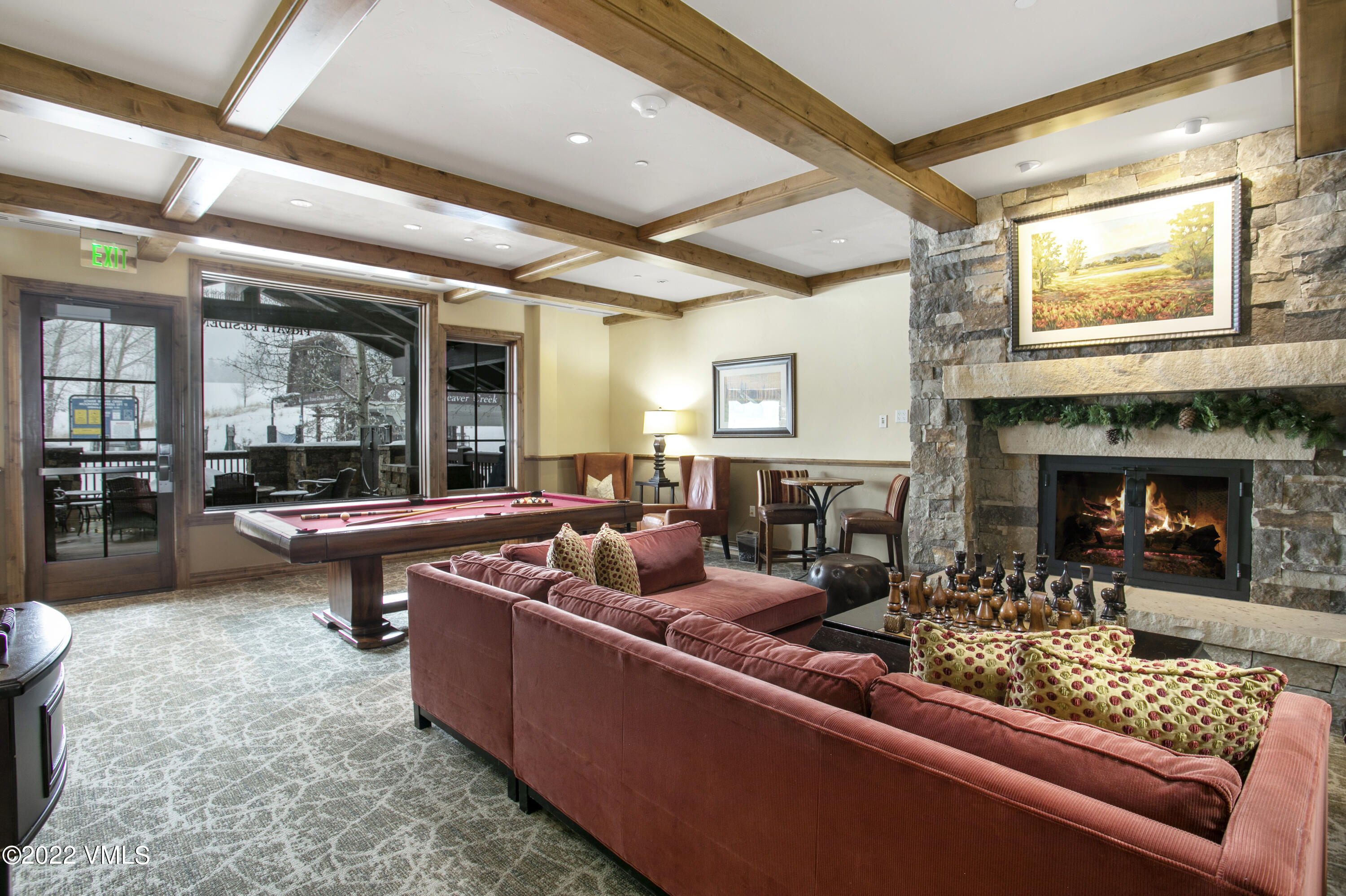 300 Prater Road, Unit B303 Beaver Creek, CO 81620 - Photo 27 of 38 a living room with furniture and a fireplace