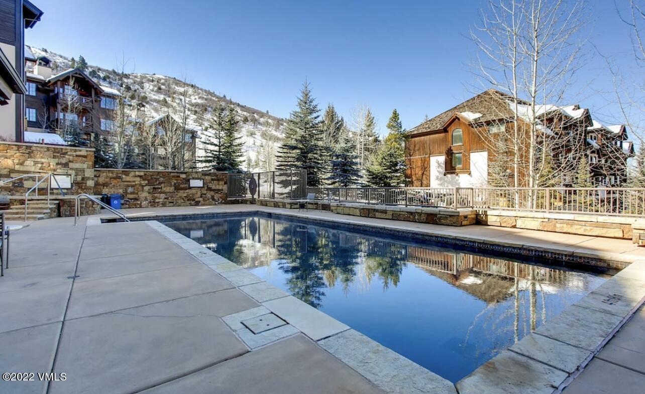 300 Prater Road, Unit B303 Beaver Creek, CO 81620 - Photo 35 of 38 a view of a swimming pool with a patio