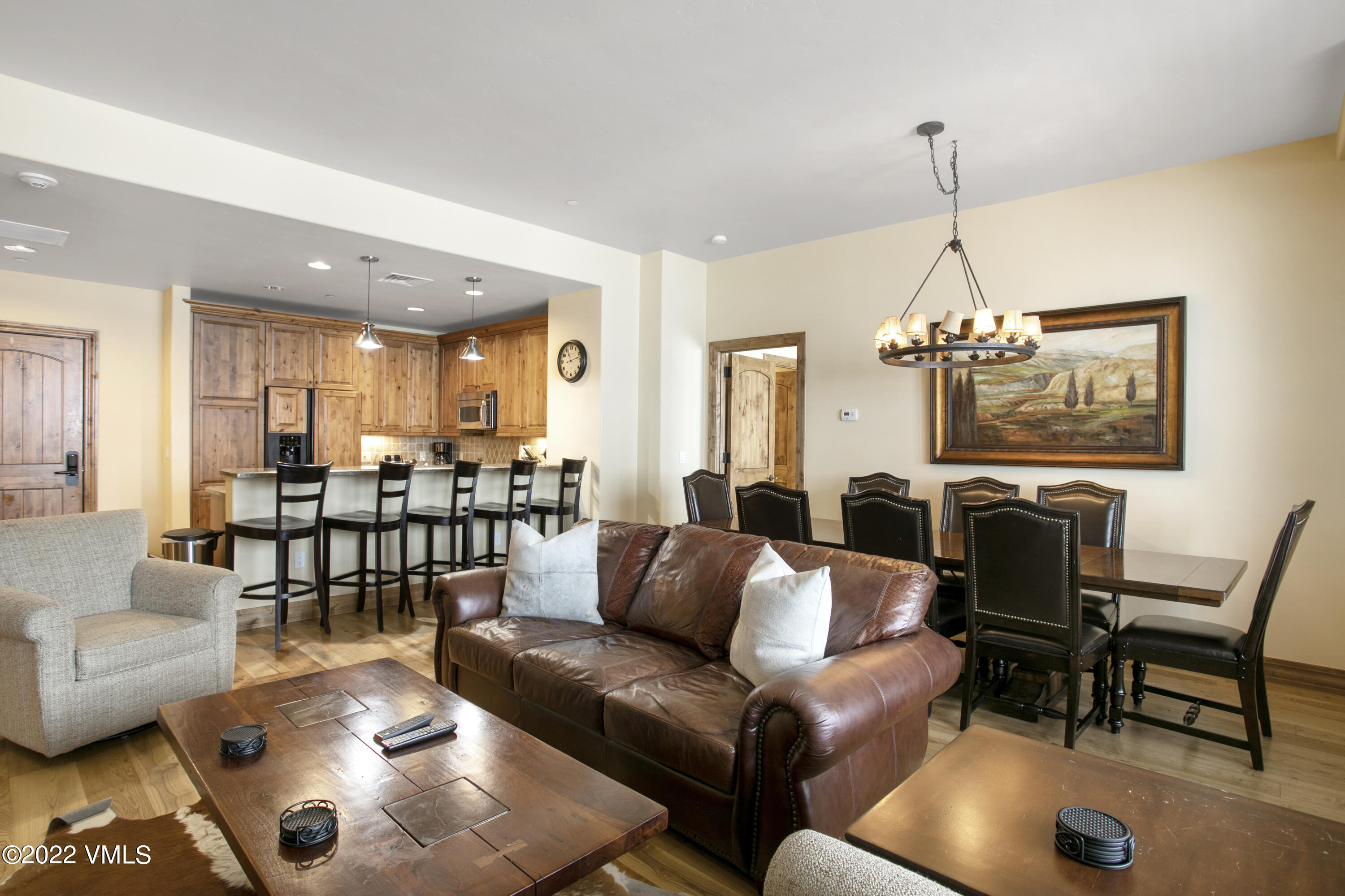 300 Prater Road, Unit B303 Beaver Creek, CO 81620 - Photo 6 of 38 a living room with furniture and a chandelier