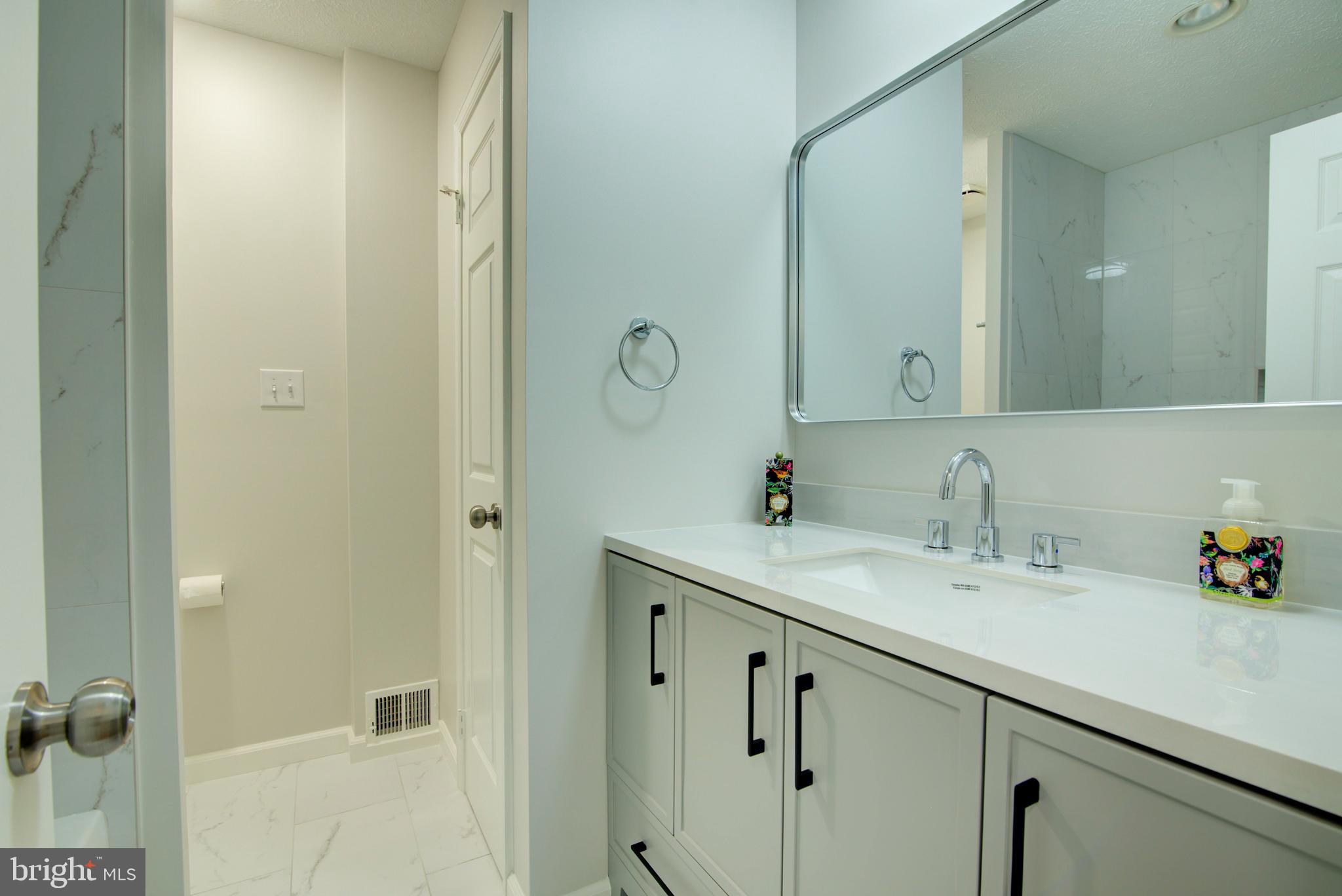 44 Carrollton Road Sterling, VA 20165 - Photo 47 of 75 Upper hall bath - new vanity w/ quartz counter top