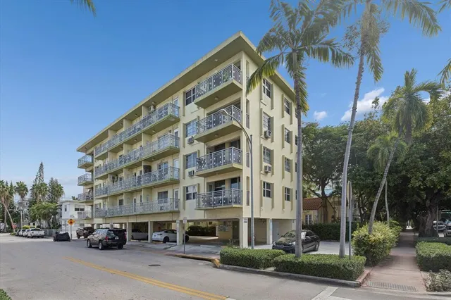 a city street lined with buildings and cars