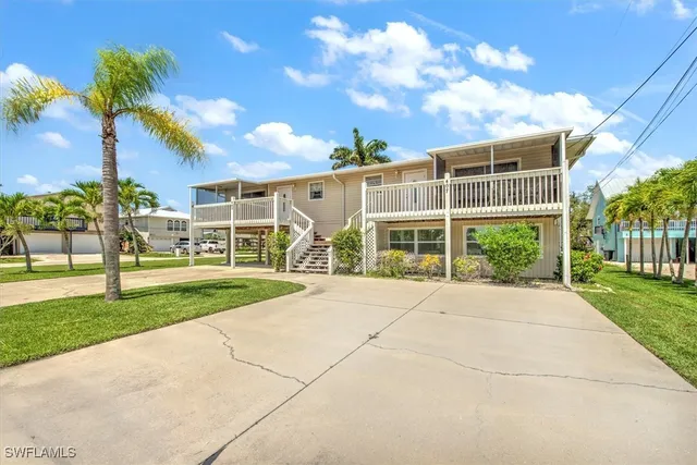 a view of a house with garden and plants