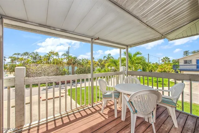 a view of a chairs and table in patio