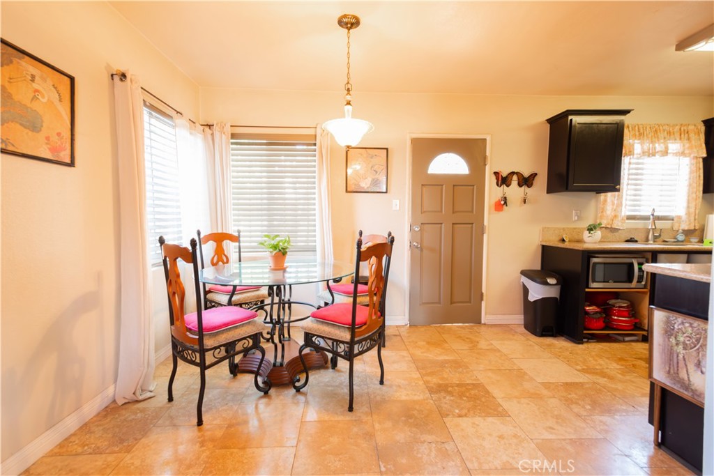 1500 West 156th Street Compton, CA 90220 - Photo 17 of 32 a dining room with furniture and window