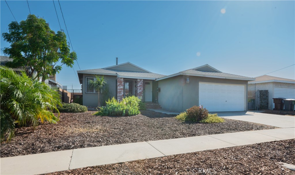 1500 West 156th Street Compton, CA 90220 - Photo 2 of 32 a front view of a house with garden
