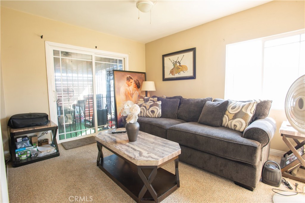 1500 West 156th Street Compton, CA 90220 - Photo 22 of 32 a living room with furniture and a flat screen tv