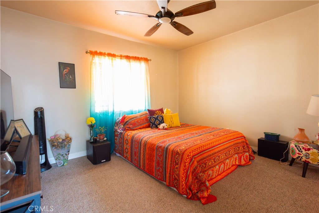 1500 West 156th Street Compton, CA 90220 - Photo 24 of 32 a bedroom with a bed and a window