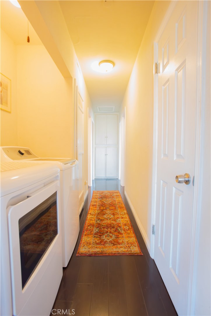 1500 West 156th Street Compton, CA 90220 - Photo 28 of 32 a view of a hallway with wooden floor and a fireplace
