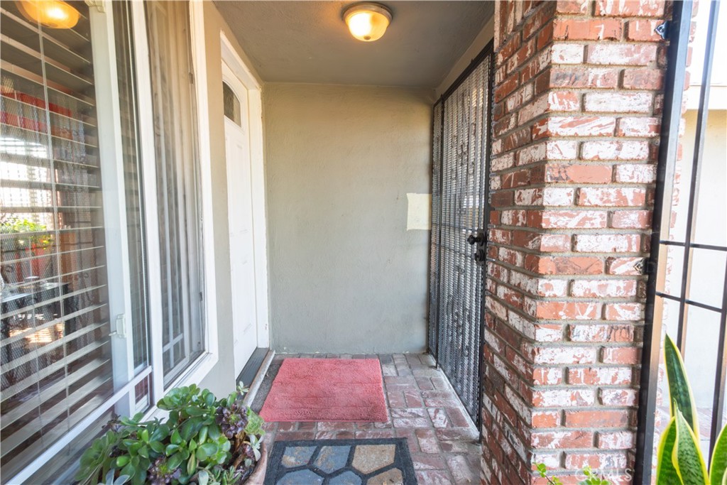 1500 West 156th Street Compton, CA 90220 - Photo 6 of 32 a entryway with a flower pot