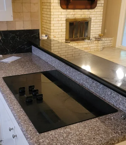 a kitchen with a sink and a stove