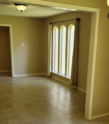 a view of empty room with windows