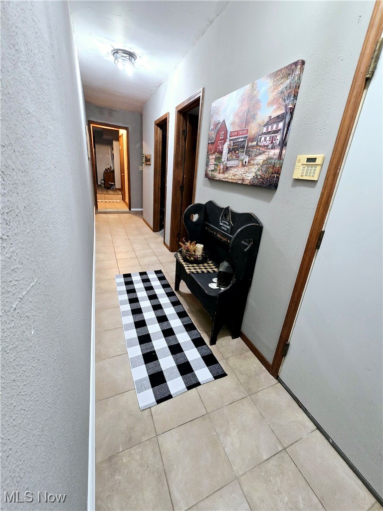 1550 North County Line Road Geneva, OH 44041 - Photo 29 of 47 Corridor with light tile flooring