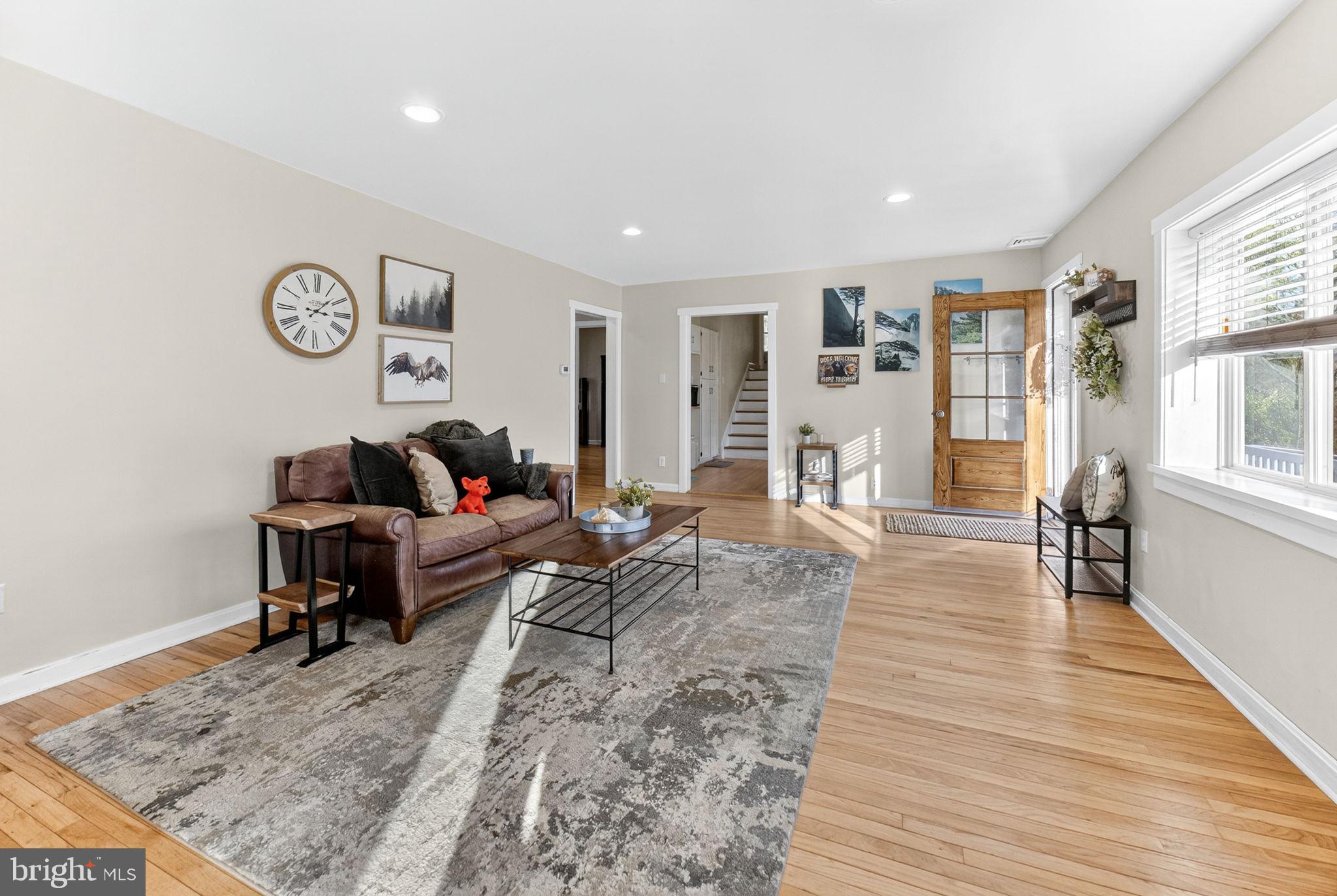 616 Bondsville Road Downingtown, PA 19335 - Photo 12 of 43 a living room with furniture and a rug