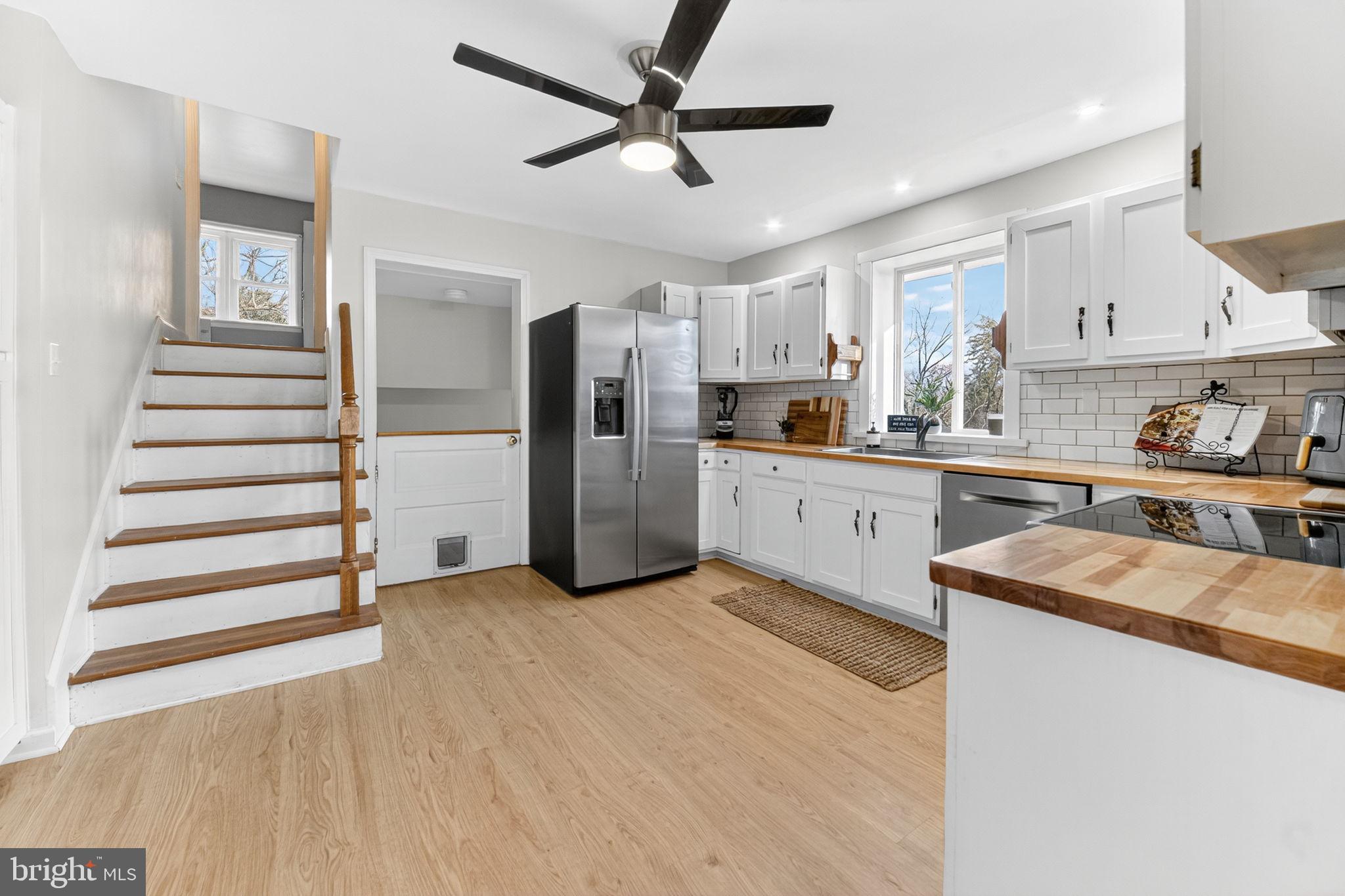 616 Bondsville Road Downingtown, PA 19335 - Photo 16 of 43 a kitchen with stainless steel appliances a stove refrigerator sink and cabinets