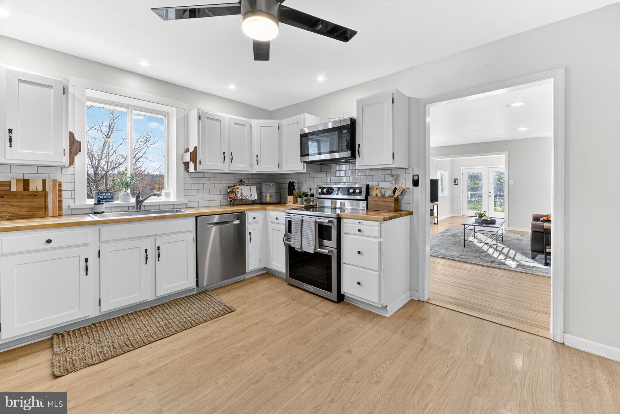 616 Bondsville Road Downingtown, PA 19335 - Photo 18 of 43 a kitchen with a sink window and stainless steel appliances