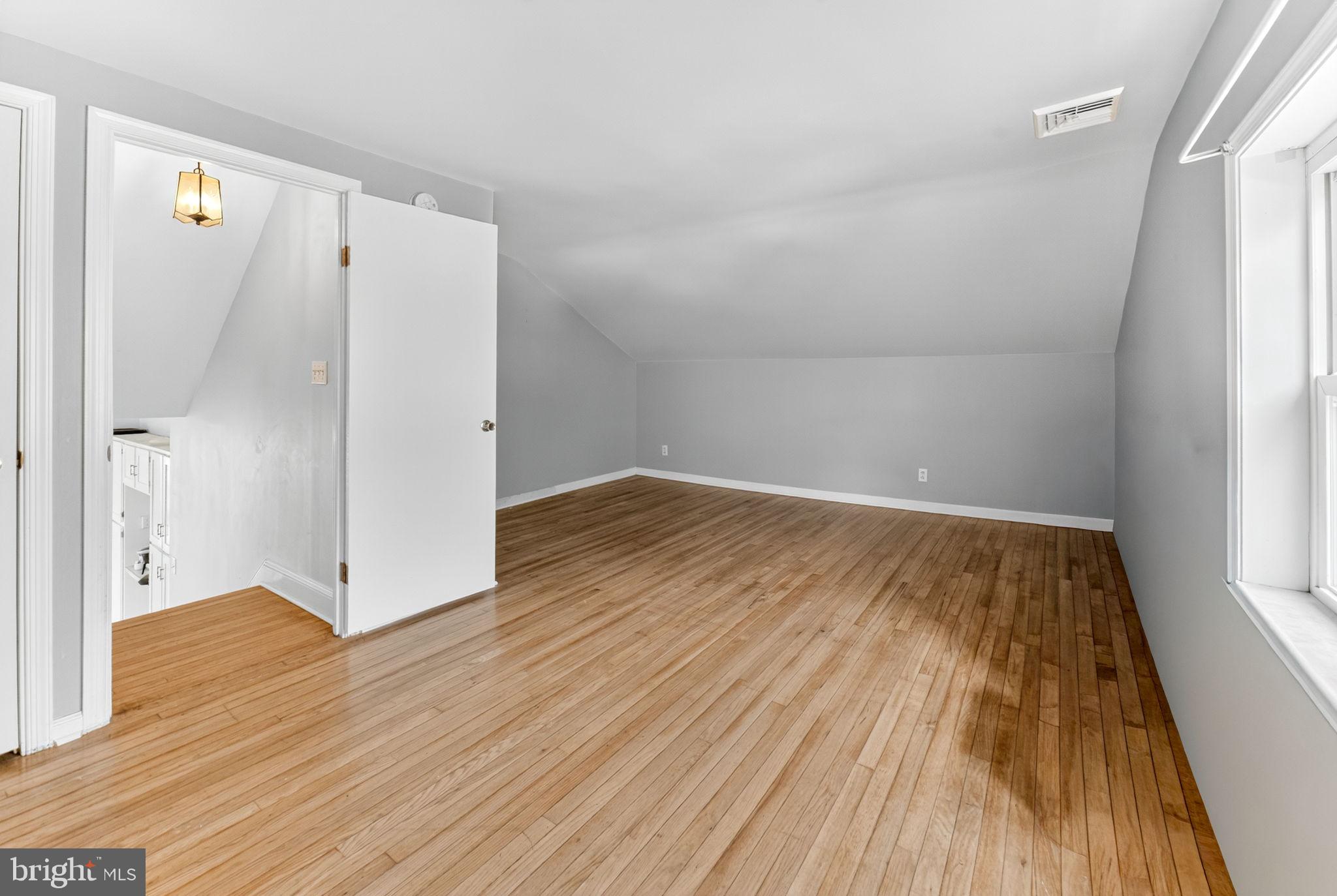 616 Bondsville Road Downingtown, PA 19335 - Photo 23 of 43 a view of a room with wooden floor and a window