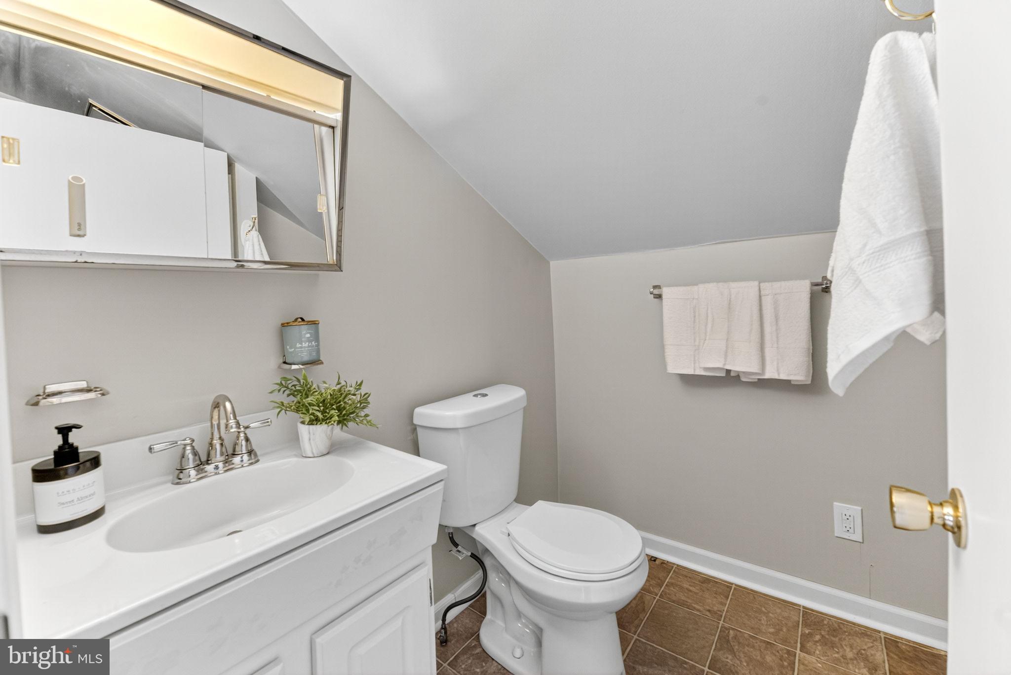 616 Bondsville Road Downingtown, PA 19335 - Photo 26 of 43 a bathroom with a sink toilet and mirror