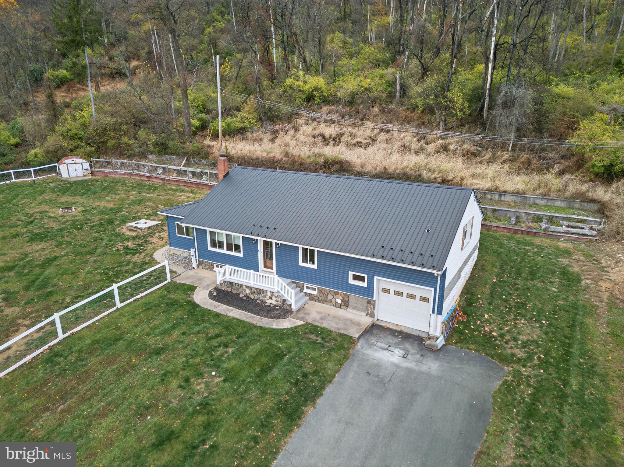 616 Bondsville Road Downingtown, PA 19335 - Photo 37 of 43 a aerial view of a house next to a big yard and large trees