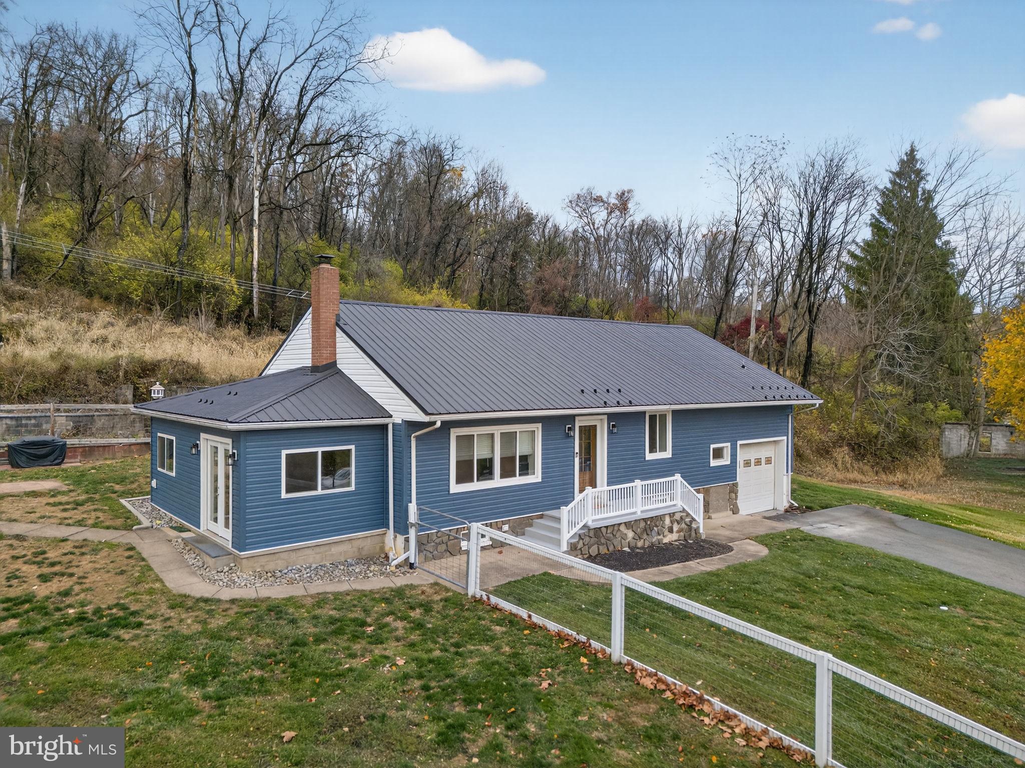 616 Bondsville Road Downingtown, PA 19335 - Photo 5 of 43 a house that has tree in front of it