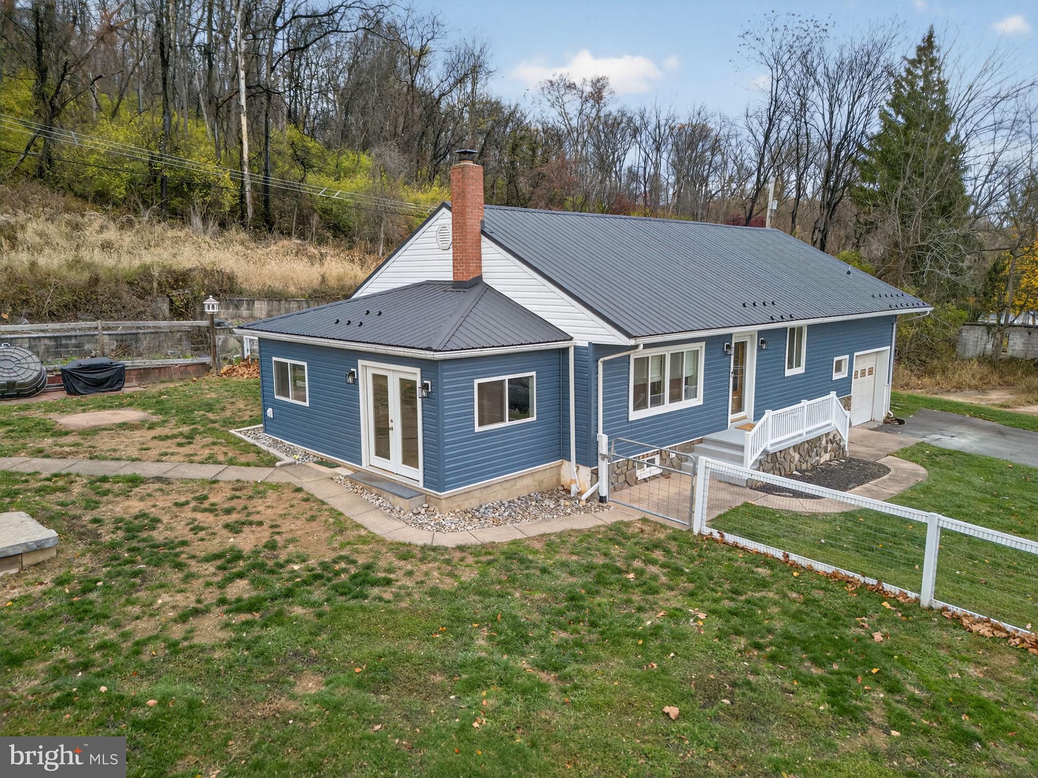 616 Bondsville Road Downingtown, PA 19335 - Photo 6 of 43 a house view with a garden space