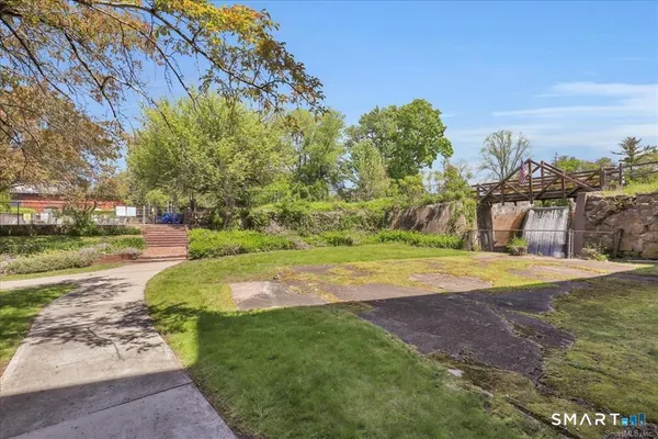 a view of a park with large trees