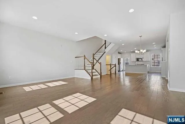 a view of a kitchen with a sink and an entryway