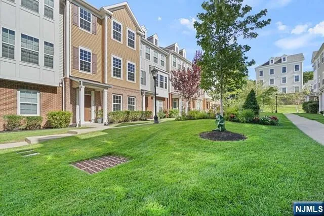 a view of a building with a yard