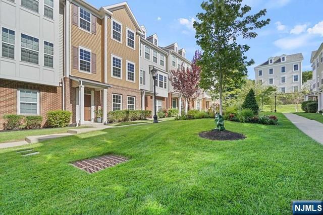 32 Truman Drive Wood-Ridge, NJ 07075 - Photo 2 of 49 a view of a building with a yard