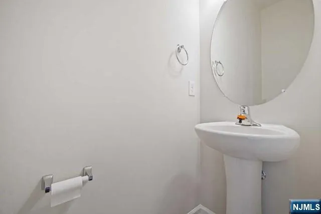 a bathroom with a sink and mirror
