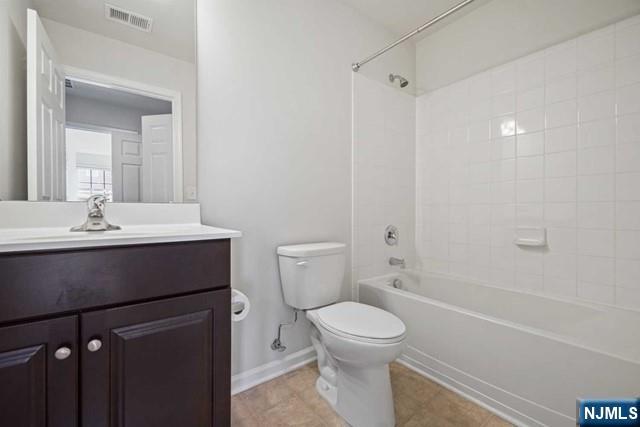 32 Truman Drive Wood-Ridge, NJ 07075 - Photo 37 of 49 a bathroom with a sink a toilet and shower