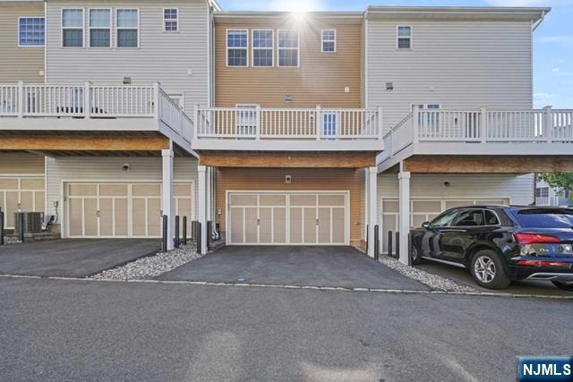 32 Truman Drive Wood-Ridge, NJ 07075 - Photo 39 of 49 a car parked in front of a building