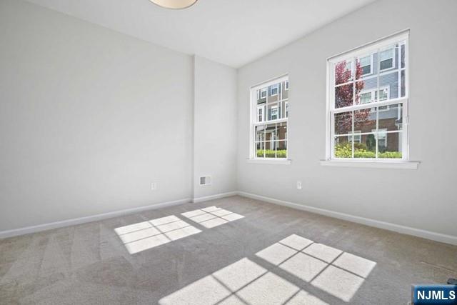 32 Truman Drive Wood-Ridge, NJ 07075 - Photo 6 of 49 an empty room with windows