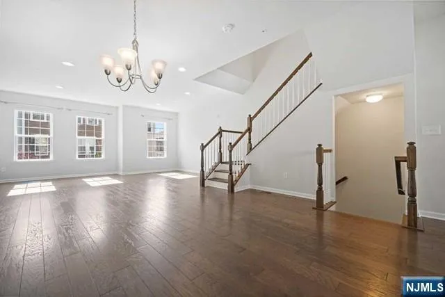 a view of an room with wooden floor and windows