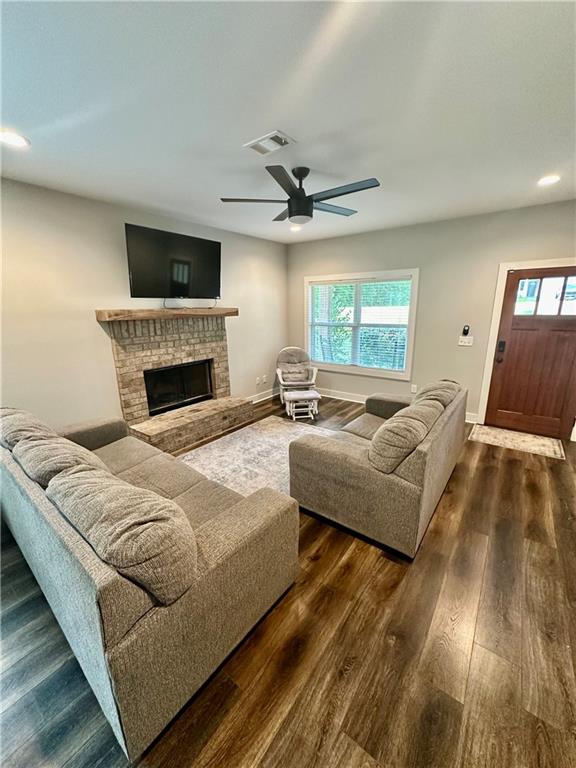 815 Poplar Street Monticello, GA 31064 - Photo 7 of 33 a living room with furniture and a fireplace