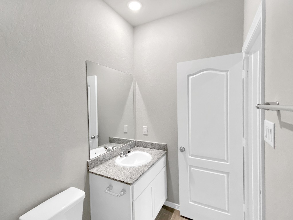 847 Redinger Ridge Drive Huffman, TX 77336 - Photo 16 of 30 a bathroom with a sink toilet and vanity