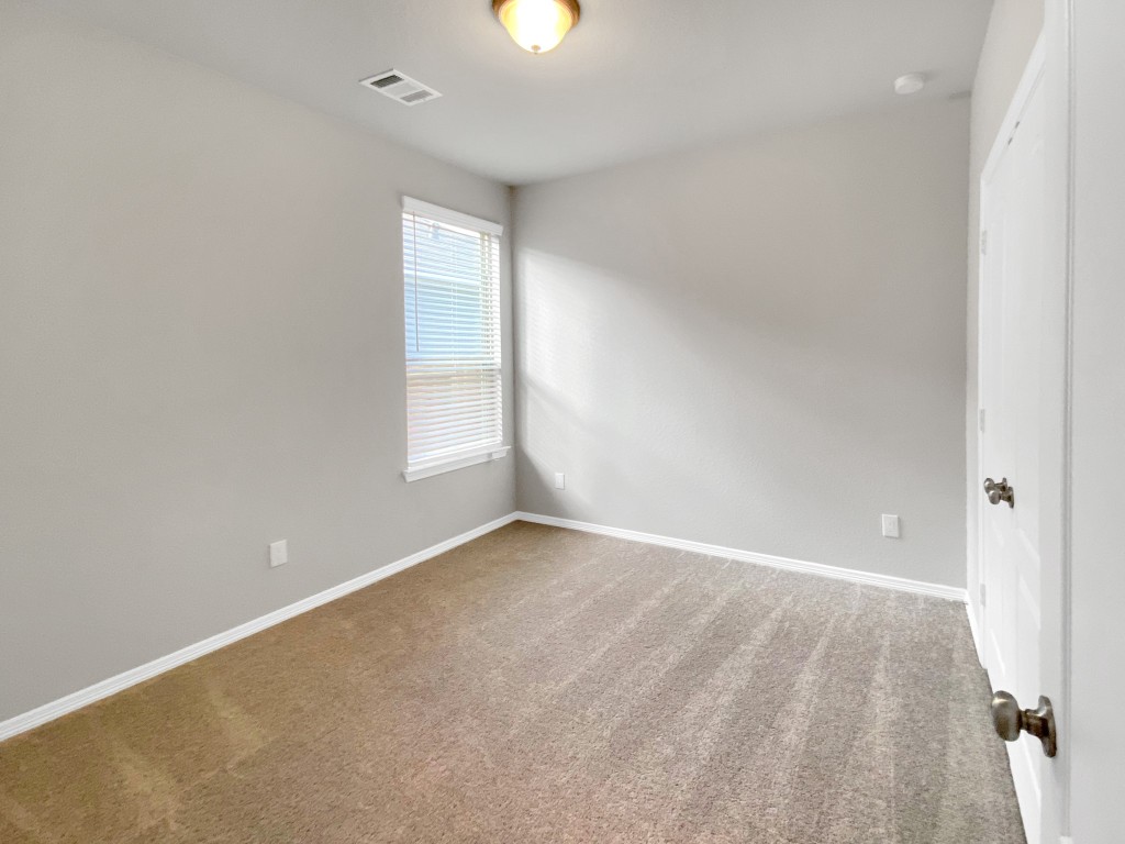 847 Redinger Ridge Drive Huffman, TX 77336 - Photo 17 of 30 wooden floor in an empty room with a window