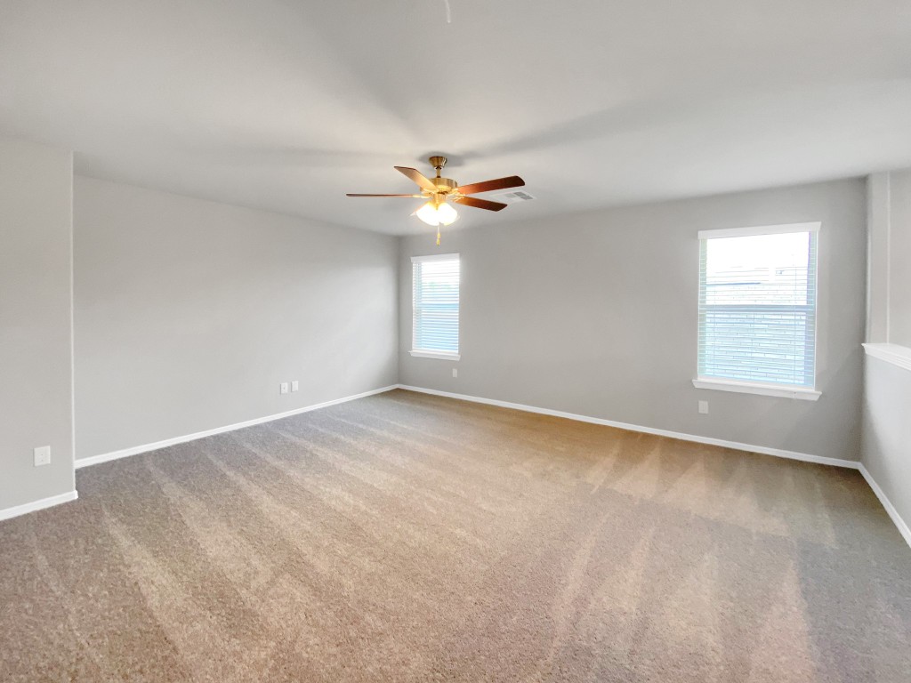 847 Redinger Ridge Drive Huffman, TX 77336 - Photo 20 of 30 wooden floor in an empty room with a window