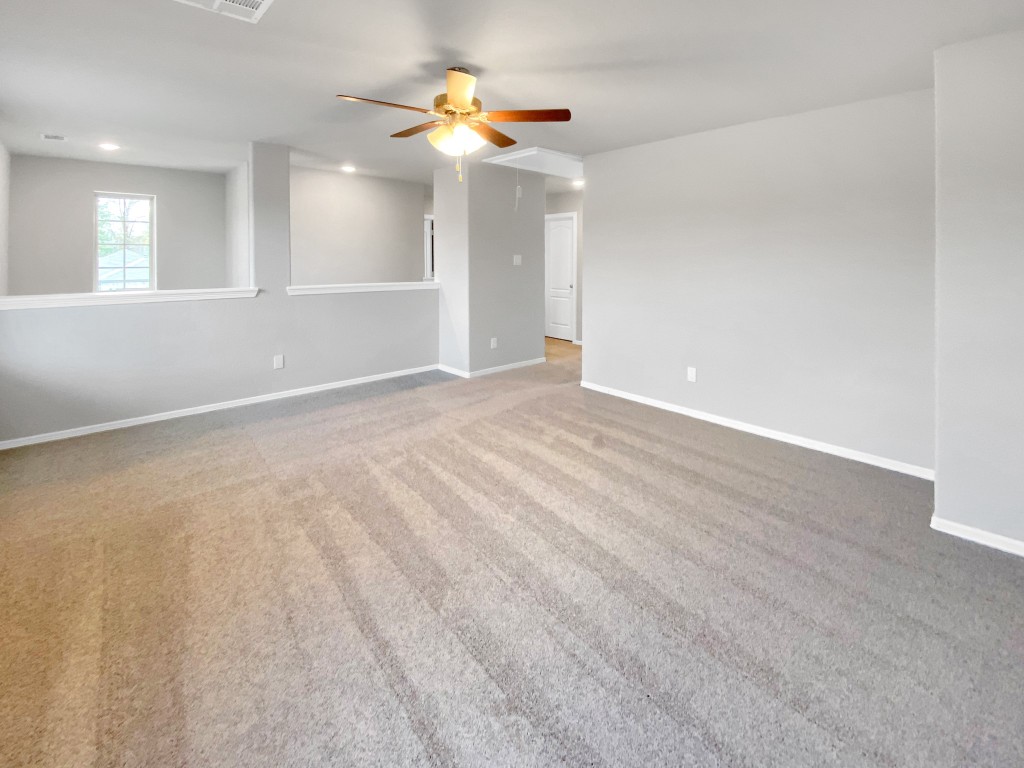 847 Redinger Ridge Drive Huffman, TX 77336 - Photo 21 of 30 wooden floor in an empty room with a window