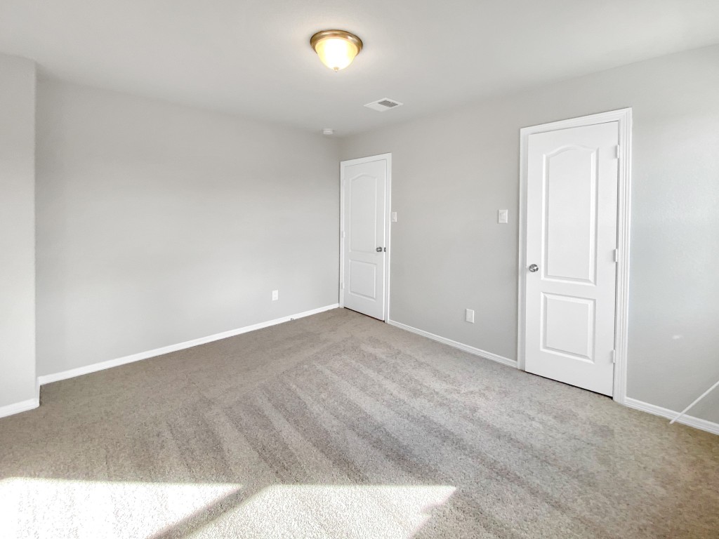 847 Redinger Ridge Drive Huffman, TX 77336 - Photo 23 of 30 an empty room with wooden floor and windows