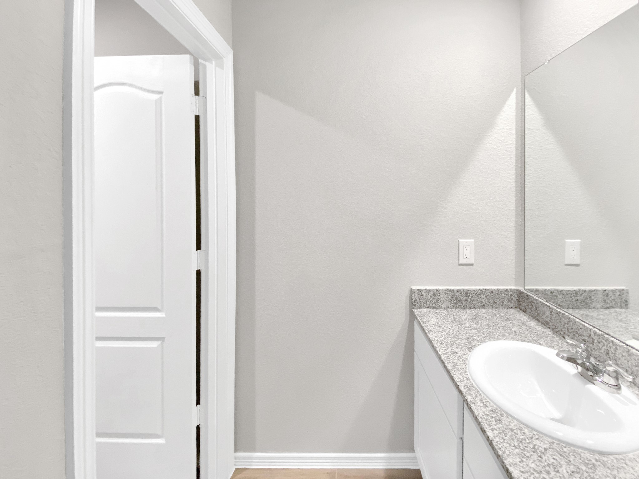 847 Redinger Ridge Drive Huffman, TX 77336 - Photo 24 of 30 a bathroom with a granite countertop sink and a mirror
