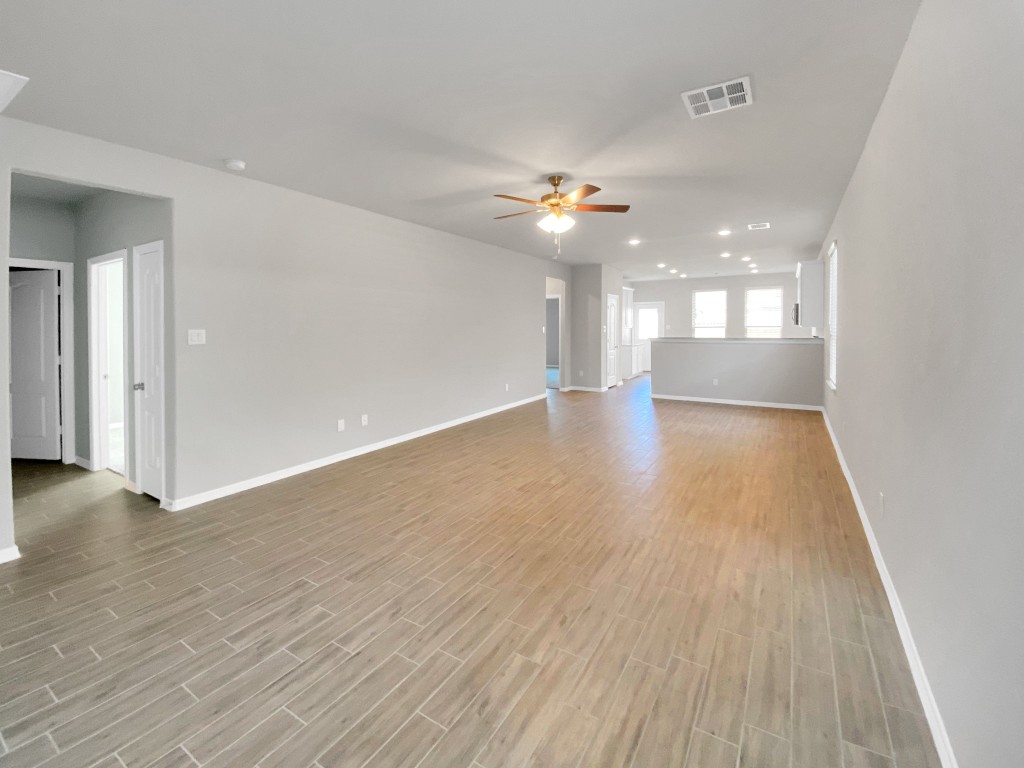847 Redinger Ridge Drive Huffman, TX 77336 - Photo 6 of 30 wooden floor in an empty room with a window