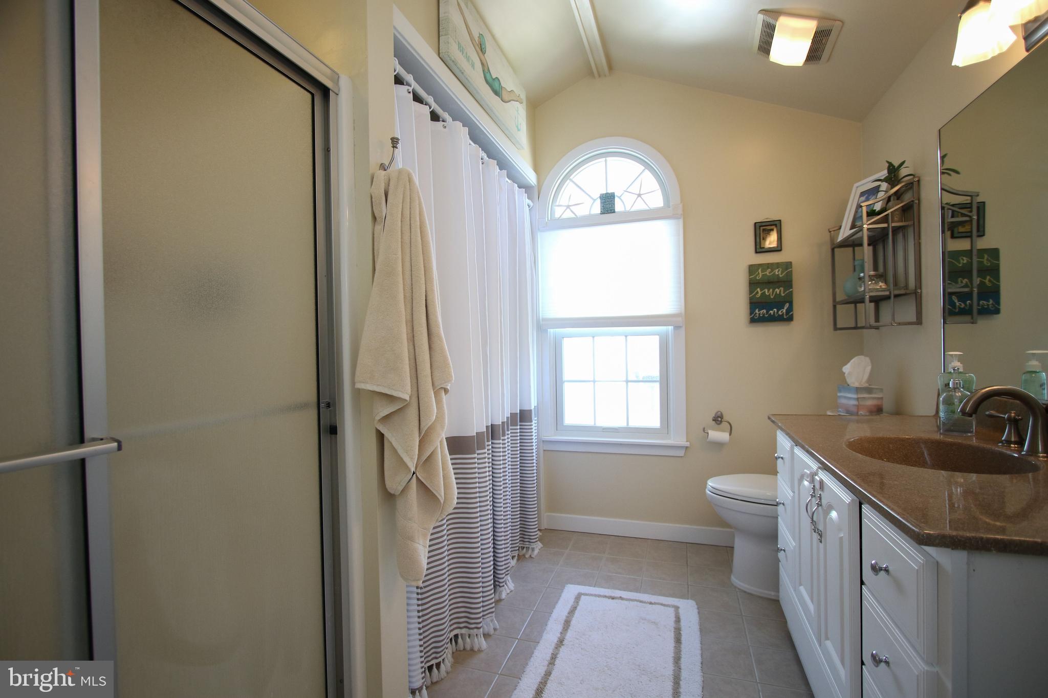 29 Alma Road Long Beach Township, NJ 08006 - Photo 32 of 43 step-in shower with laundry behind curtain