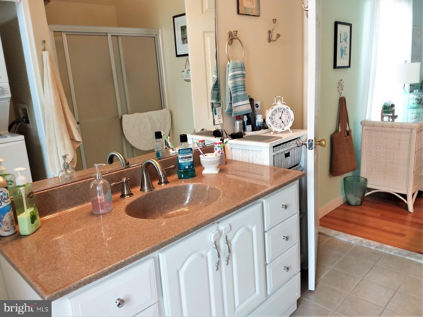 29 Alma Road Long Beach Township, NJ 08006 - Photo 34 of 43 vanity mirror reflects the room