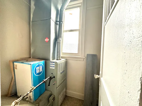 a room with a window and washer